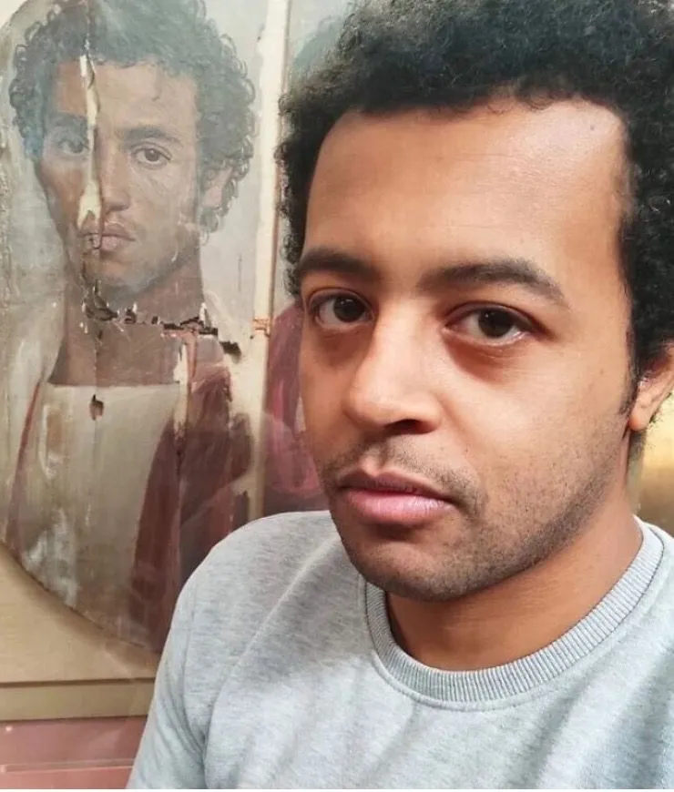 27. An Egyptian Captures a Selfie Alongside a 2,000-year-old Depiction of His Double.jpg?format=webp